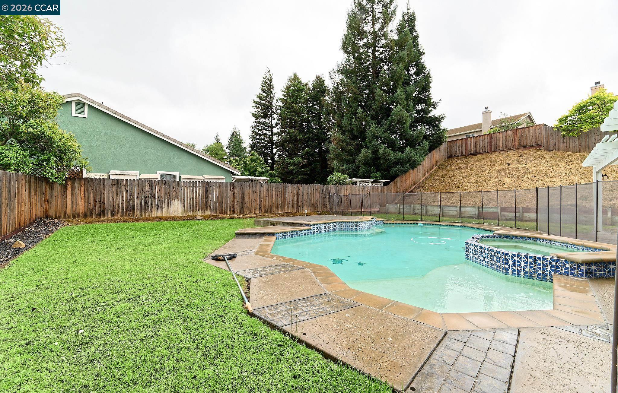 1128 Prewett Ranch Drive Antioch, CA 94531 - Photo 12 of 31 a view of a backyard with swimming pool