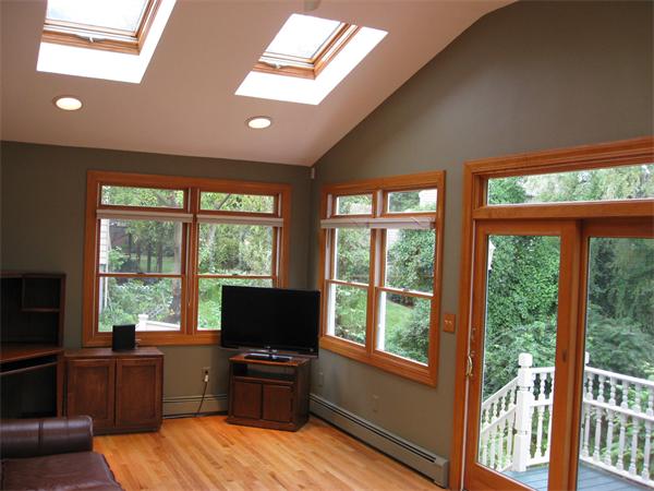 1 Ellen Road Marblehead, MA 01945 - Photo 16 of 30 a living room with furniture a flat screen tv and large windows