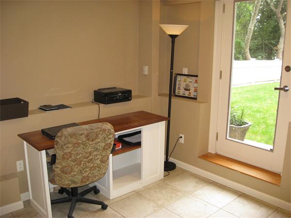 1 Ellen Road Marblehead, MA 01945 - Photo 18 of 30 a living room with a couch and a table