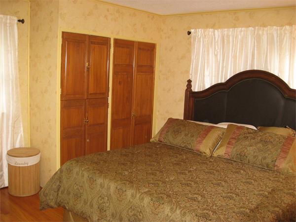 1 Ellen Road Marblehead, MA 01945 - Photo 25 of 30 a bedroom with a bed and a dresser
