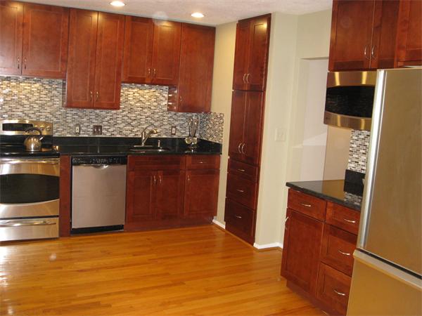 1 Ellen Road Marblehead, MA 01945 - Photo 8 of 30 a kitchen with granite countertop wooden cabinets and a counter top space