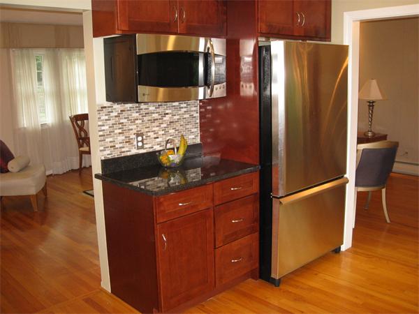 1 Ellen Road Marblehead, MA 01945 - Photo 10 of 30 a kitchen with stainless steel appliances granite countertop a refrigerator and a stove