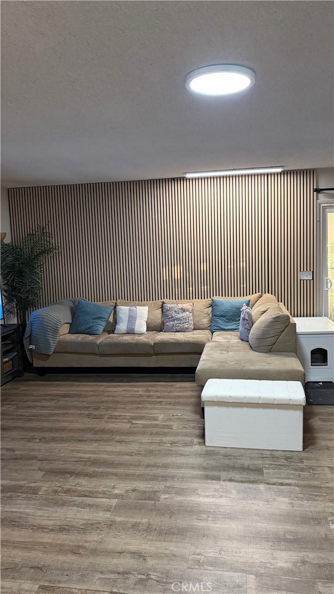 646 El Rancho Drive El Cajon, CA 92019 - Photo 7 of 23 a view of a couch in wooden floor