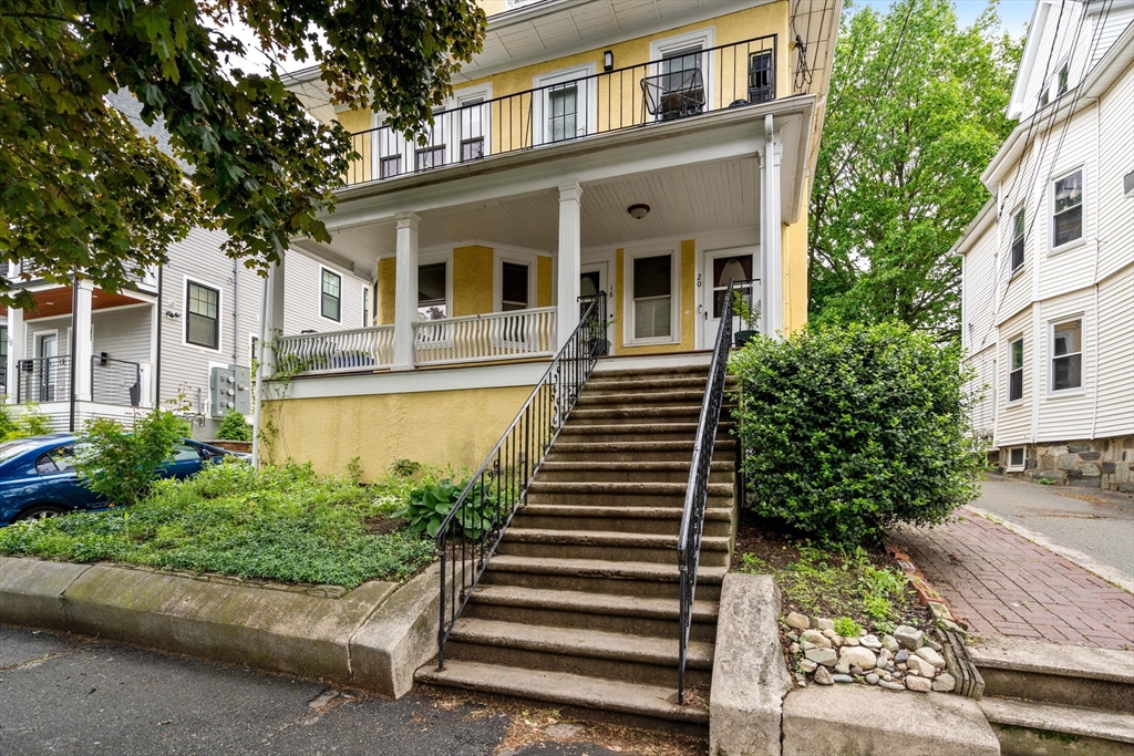 18 Park Road, Unit 1 Belmont, MA 02478 - Photo 1 of 36 a front view of a house with a yard