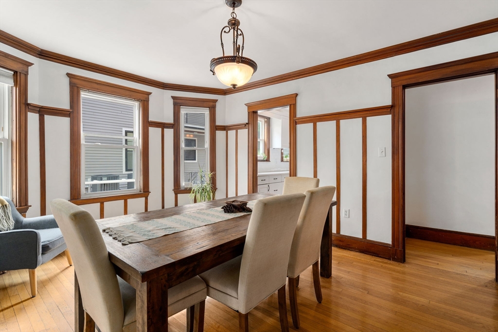 18 Park Road, Unit 1 Belmont, MA 02478 - Photo 12 of 36 a view of a dining room with furniture window and wooden floor