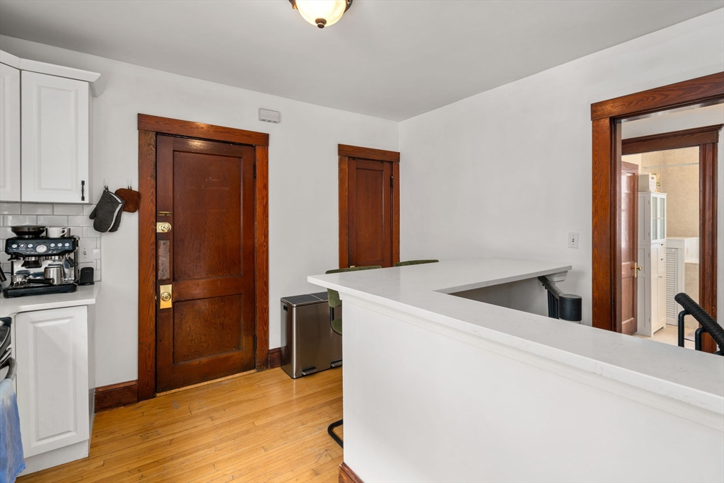 18 Park Road, Unit 1 Belmont, MA 02478 - Photo 17 of 36 a view of a kitchen from the hallway