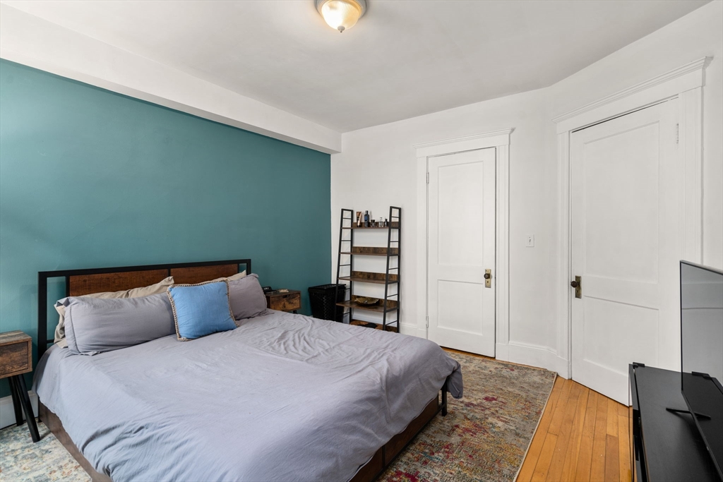 18 Park Road, Unit 1 Belmont, MA 02478 - Photo 23 of 36 a bedroom with a bed and a window