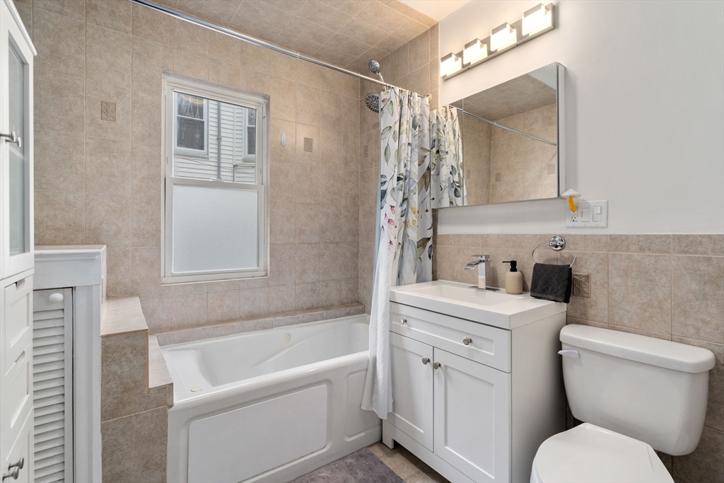 18 Park Road, Unit 1 Belmont, MA 02478 - Photo 24 of 36 a bathroom with a toilet sink and bathtub