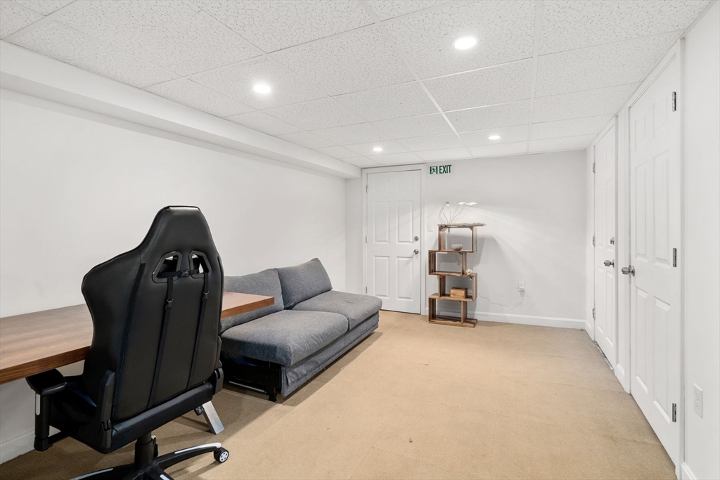 18 Park Road, Unit 1 Belmont, MA 02478 - Photo 29 of 36 a living room with furniture and a air conditioner vent