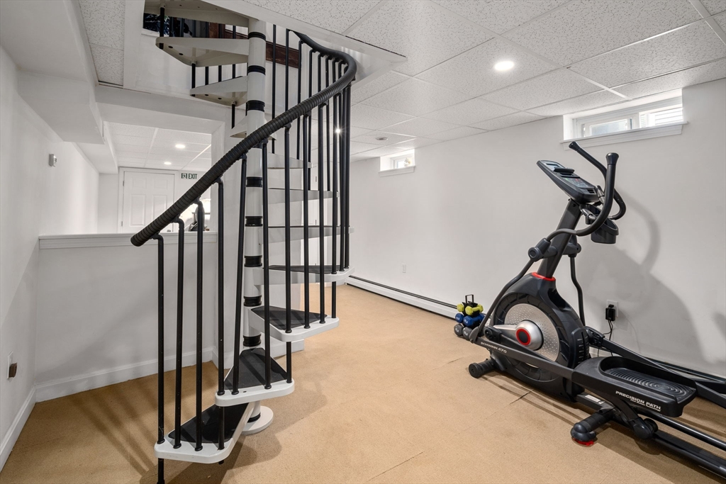 18 Park Road, Unit 1 Belmont, MA 02478 - Photo 31 of 36 a view of a room with gym equipment