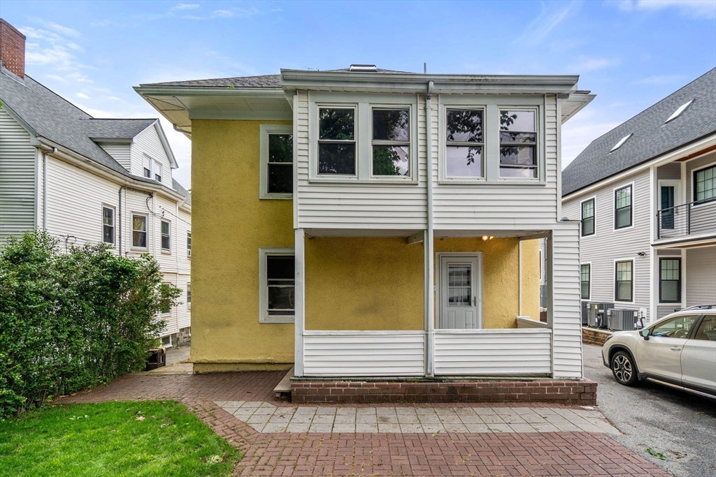 18 Park Road, Unit 1 Belmont, MA 02478 - Photo 33 of 36 a view of a house with a garden