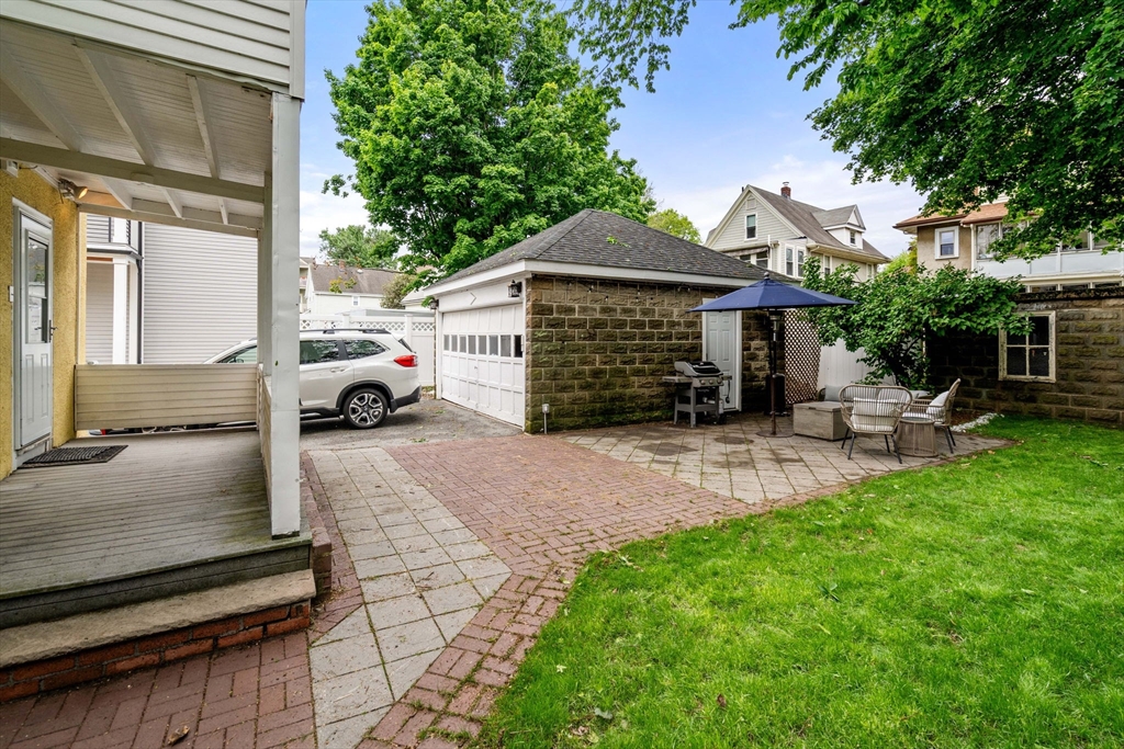 18 Park Road, Unit 1 Belmont, MA 02478 - Photo 35 of 36 a front view of a house with a yard