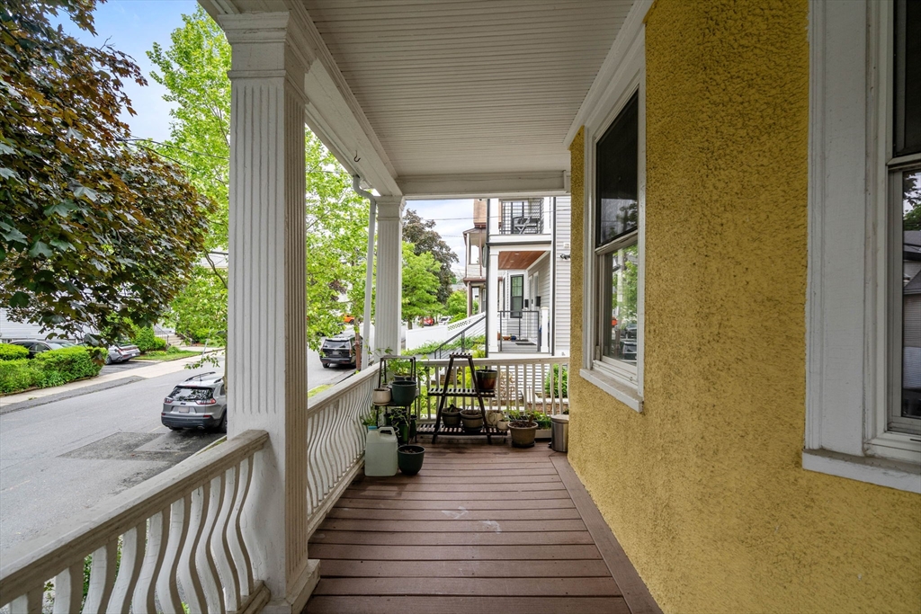 18 Park Road, Unit 1 Belmont, MA 02478 - Photo 4 of 36 a view of balcony with wooden floor and outdoor space