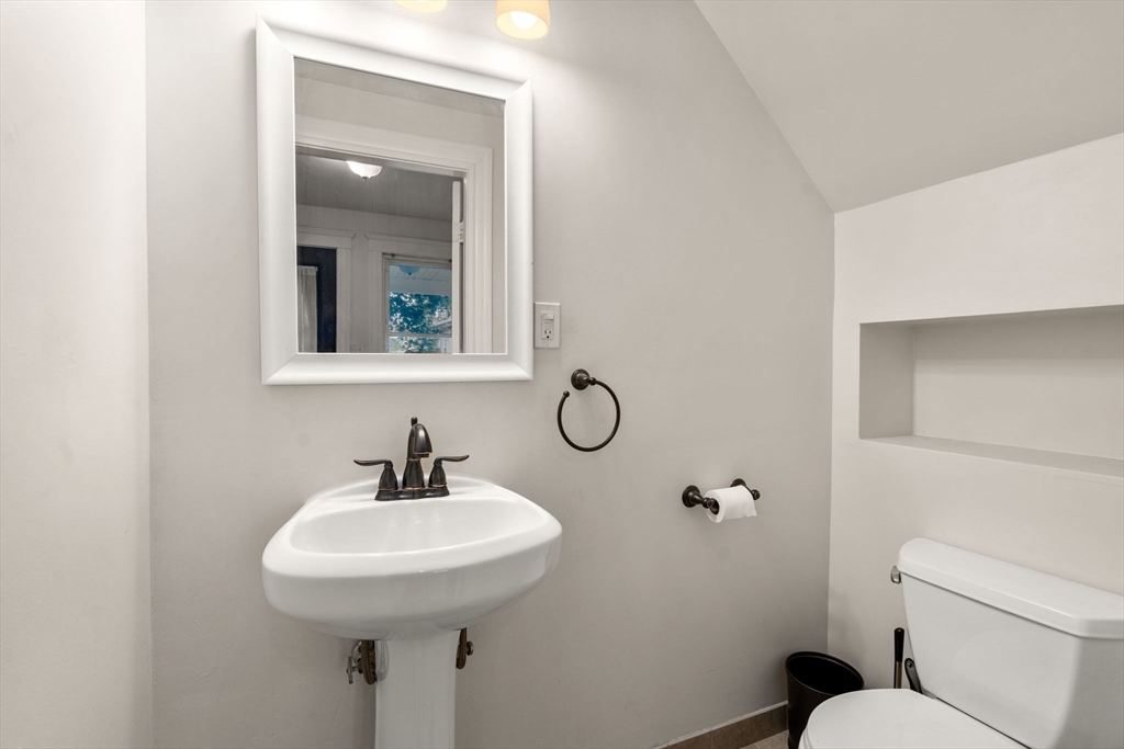 18 Park Road, Unit 1 Belmont, MA 02478 - Photo 9 of 36 a bathroom with a sink toilet and mirror