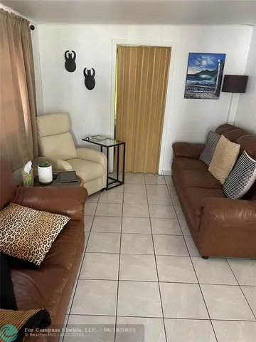 a living room with a couch and a rug