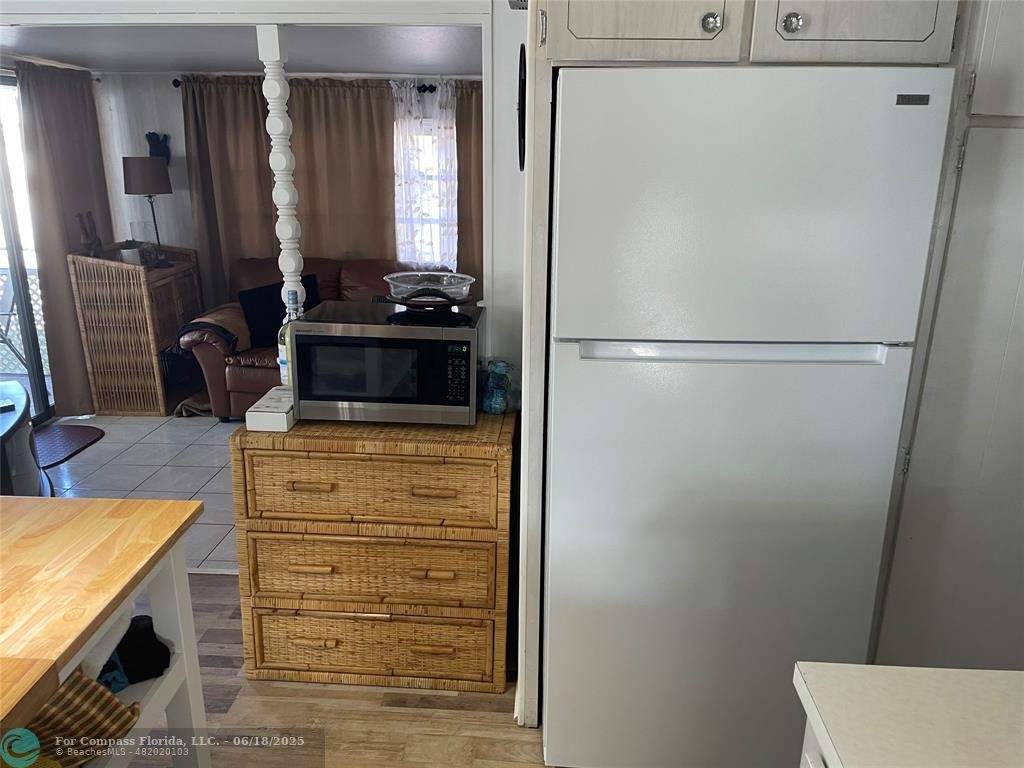 8610 Southwest 18th Court Davie, FL 33324 - Photo 7 of 17 a kitchen with a refrigerator and dresser