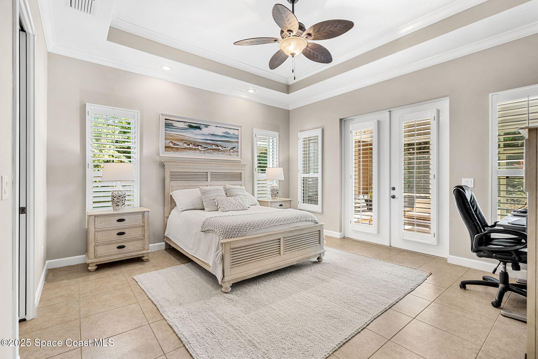 231 Loggerhead Drive Melbourne Beach, FL 32951 - Photo 13 of 47 a spacious bedroom with a bed a table and chair