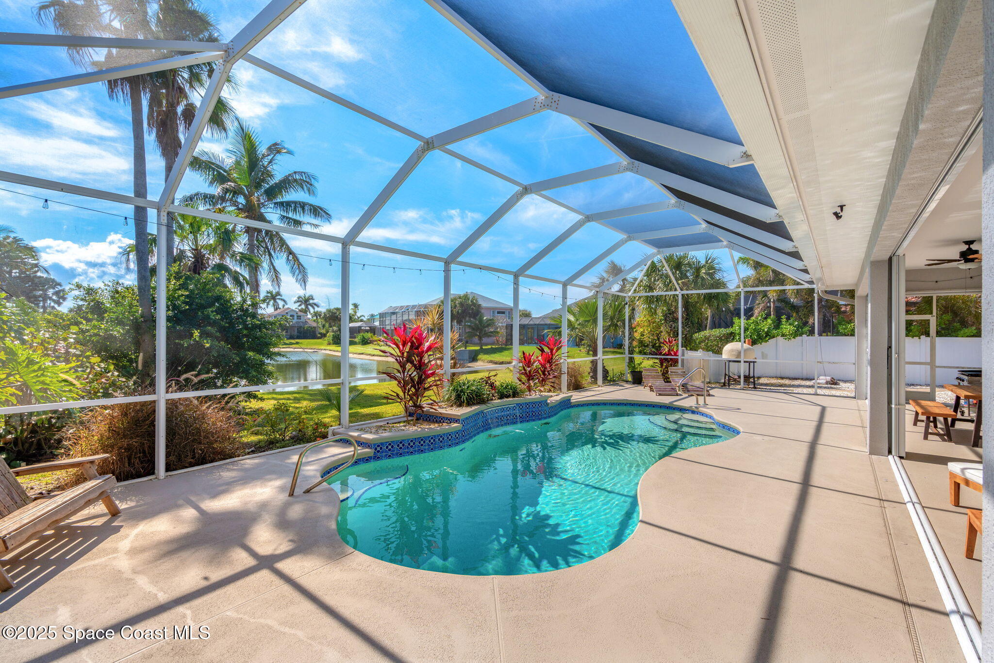 231 Loggerhead Drive Melbourne Beach, FL 32951 - Photo 2 of 47 a view of a swimming pool with a patio