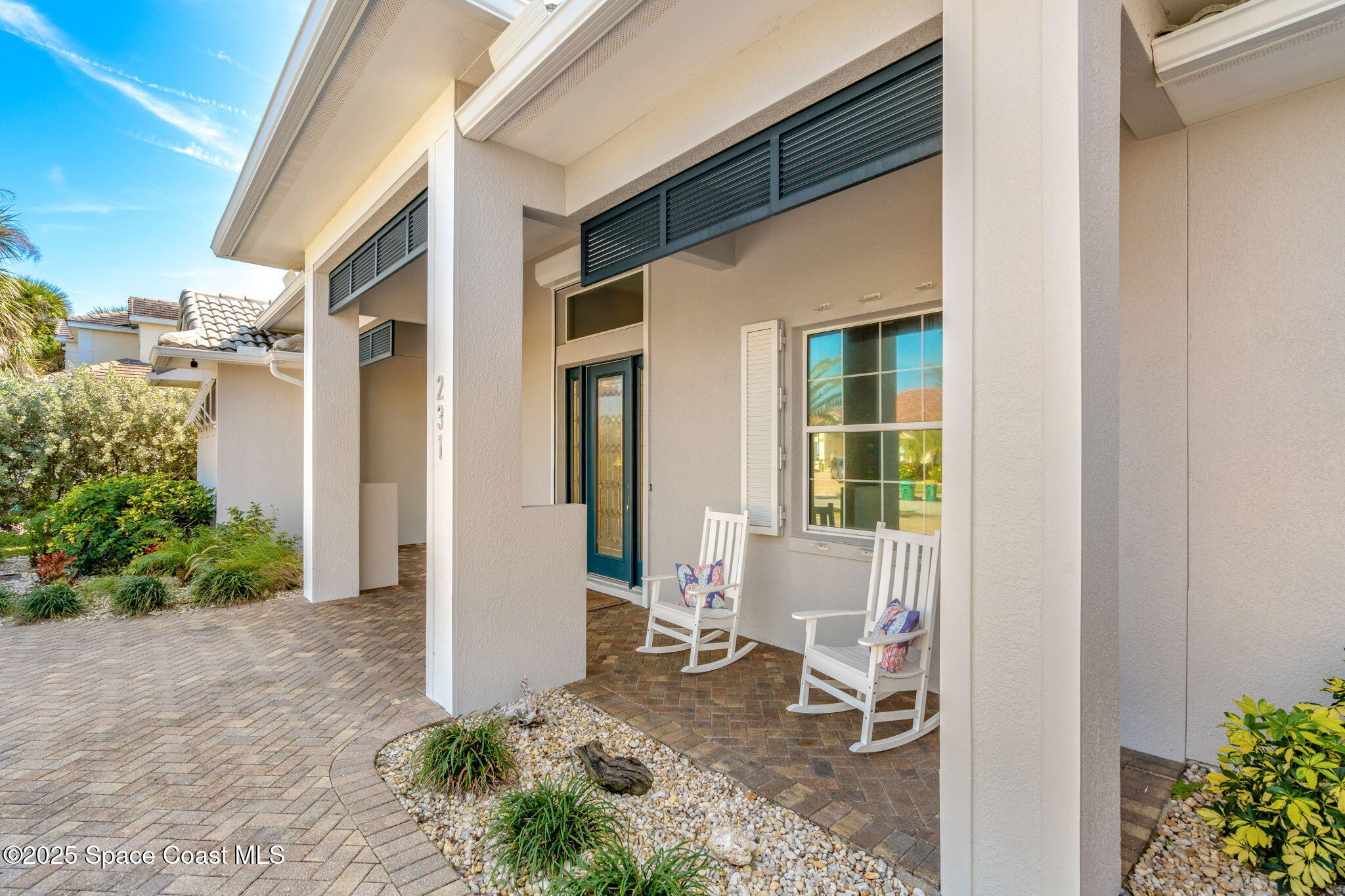 231 Loggerhead Drive Melbourne Beach, FL 32951 - Photo 30 of 47 a backyard of a house with yard and outdoor seating
