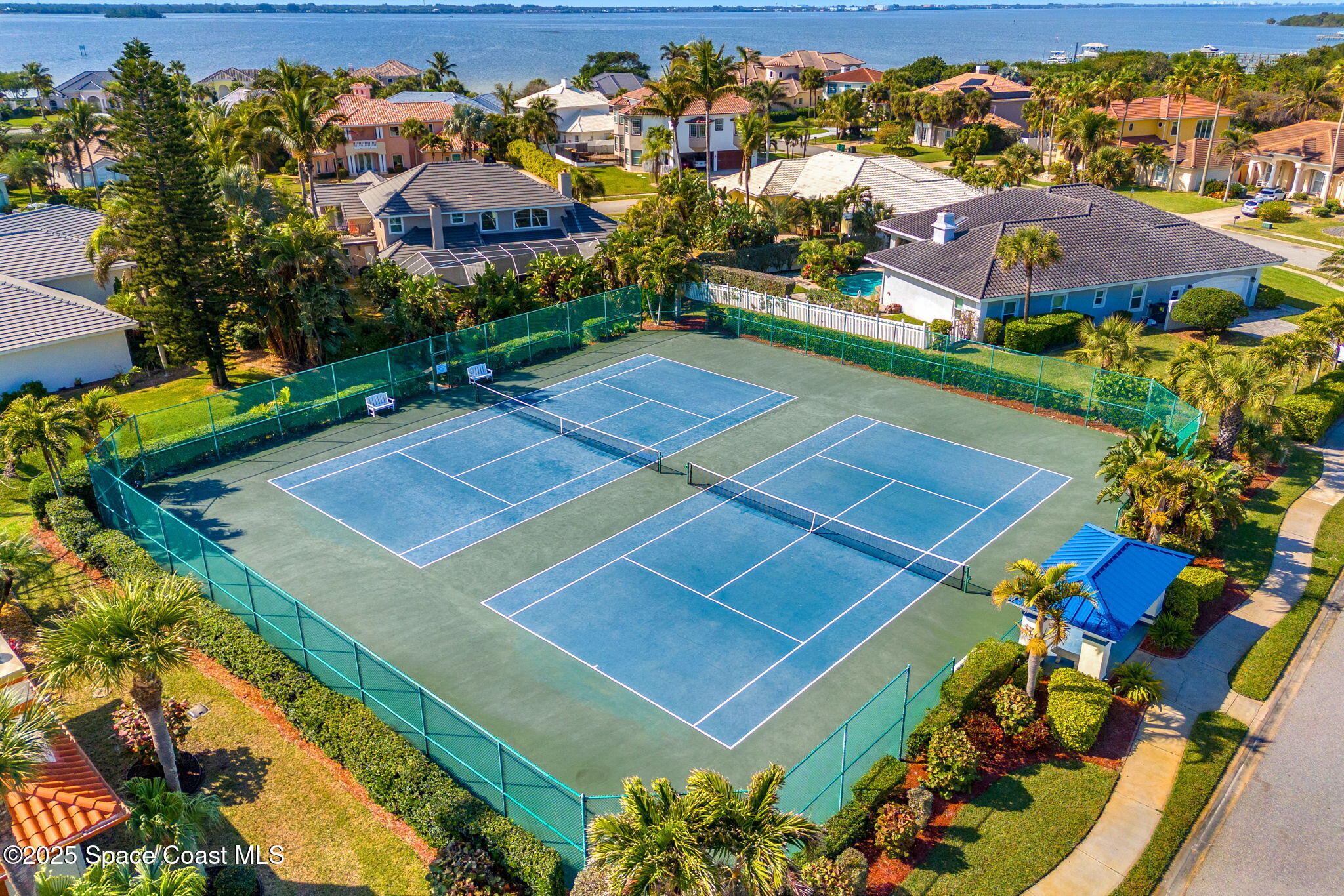 231 Loggerhead Drive Melbourne Beach, FL 32951 - Photo 40 of 47 an aerial view of a tennis ground and a cars park side of the road