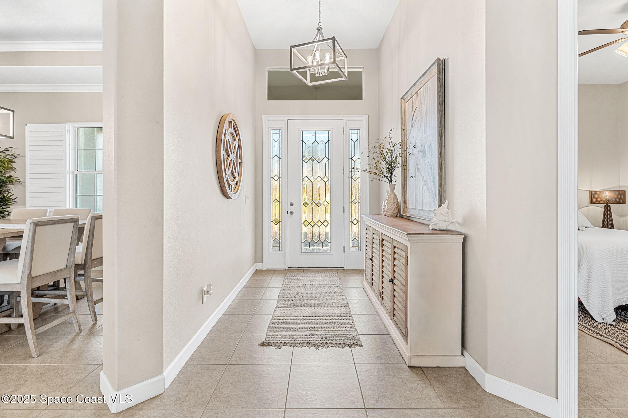 231 Loggerhead Drive Melbourne Beach, FL 32951 - Photo 4 of 47 a hallway with dining table and chairs