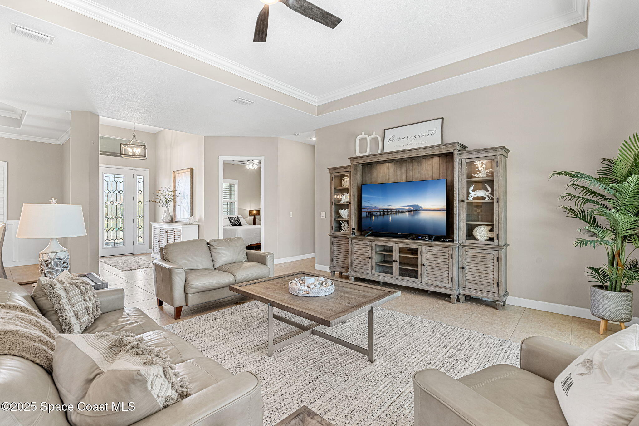 231 Loggerhead Drive Melbourne Beach, FL 32951 - Photo 8 of 47 a living room with furniture and a flat screen tv