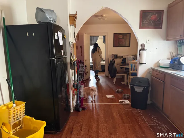 a bedroom with a bed and a television