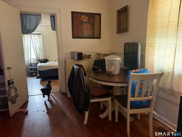 a room with furniture and gym equipment