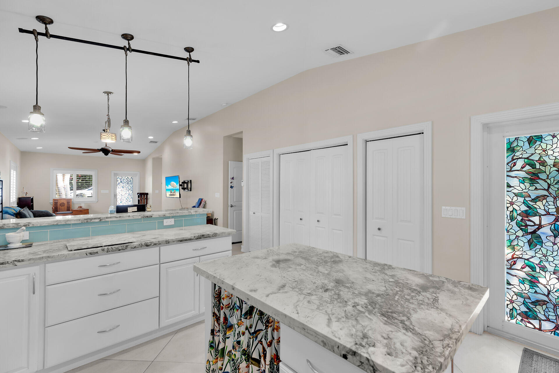 460 Lime Drive Key Largo, FL 33037 - Photo 14 of 49 a kitchen with kitchen island white cabinets and white appliances