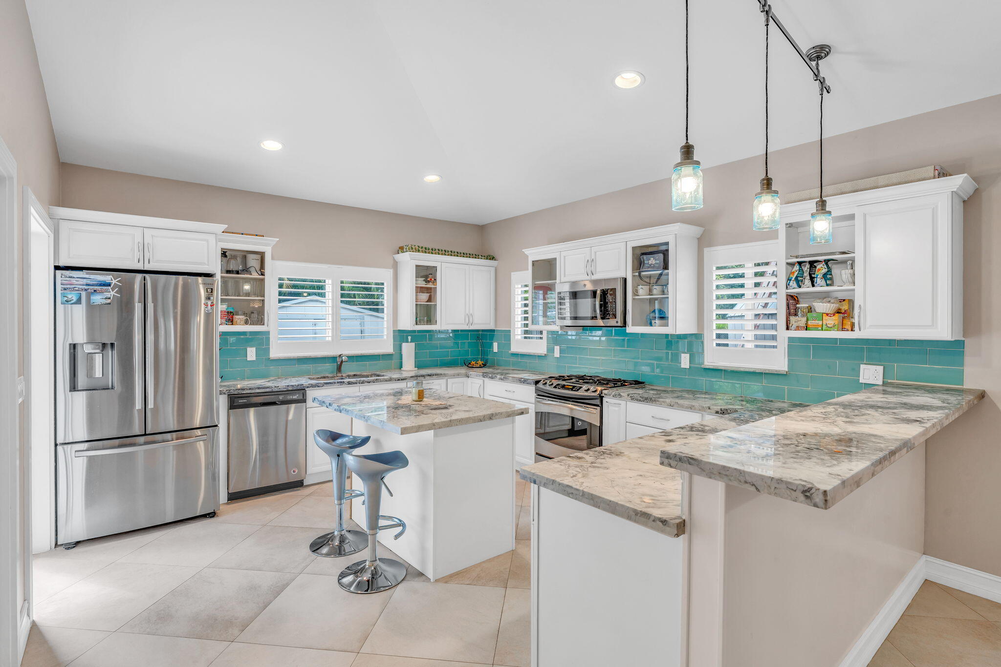 460 Lime Drive Key Largo, FL 33037 - Photo 15 of 49 a kitchen with a sink a counter top space stainless steel appliances and cabinets