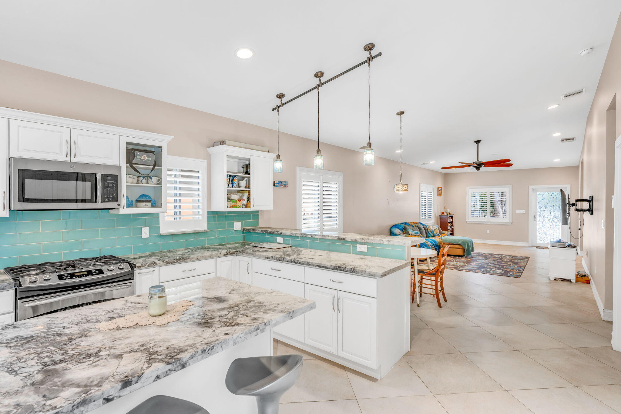460 Lime Drive Key Largo, FL 33037 - Photo 10 of 49 a kitchen with stainless steel appliances granite countertop a sink and a refrigerator