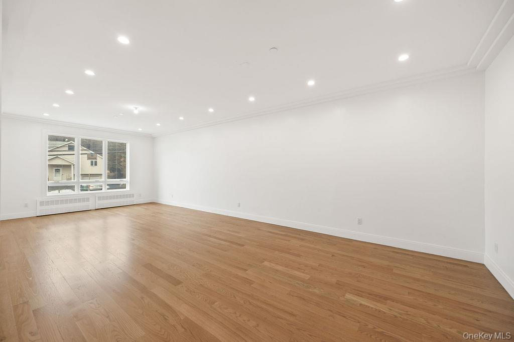 62 Blauvelt Road, Unit 202 Monsey, NY 10952 - Photo 8 of 34 a view of an empty room with wooden floor and a window