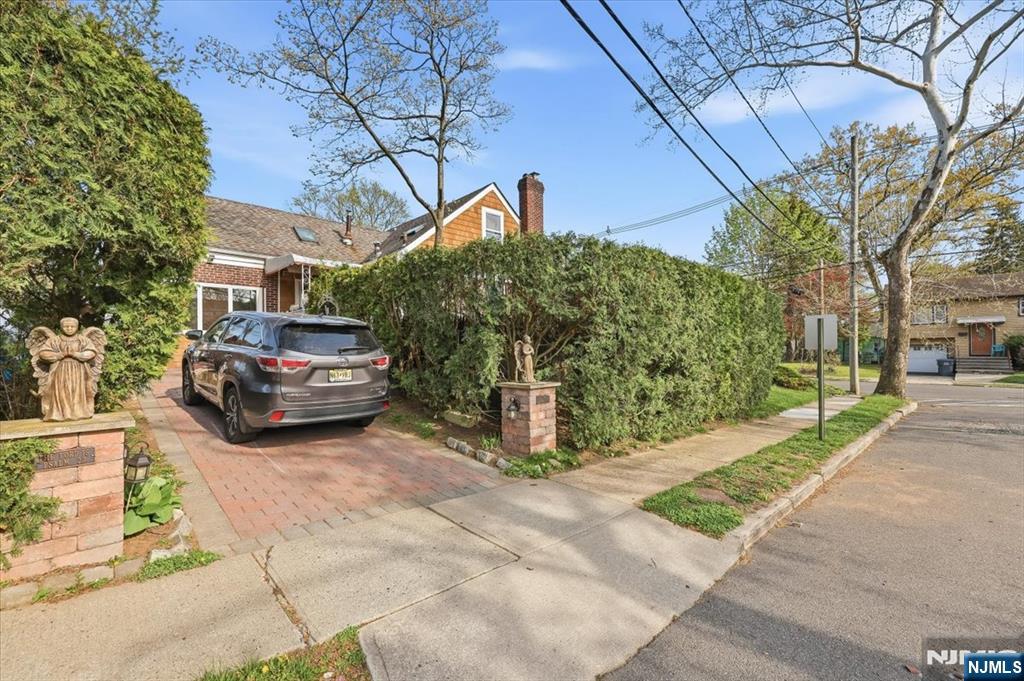 409 Tryon Avenue Englewood, NJ 07631 - Photo 3 of 33 a car parked in front of a house