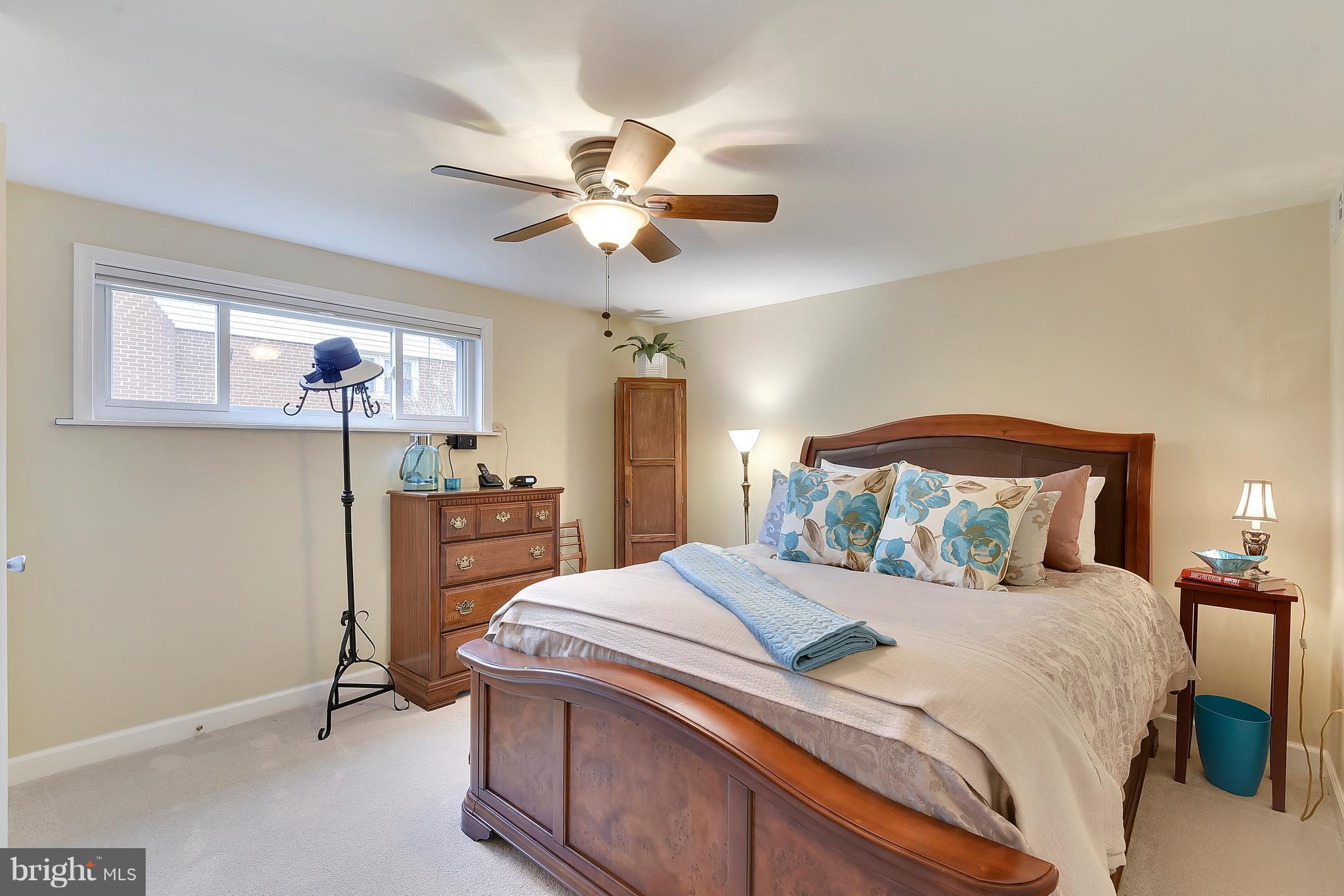8108 Ellet Road Springfield, VA 22151 - Photo 14 of 21 a bedroom with a bed and a chandelier