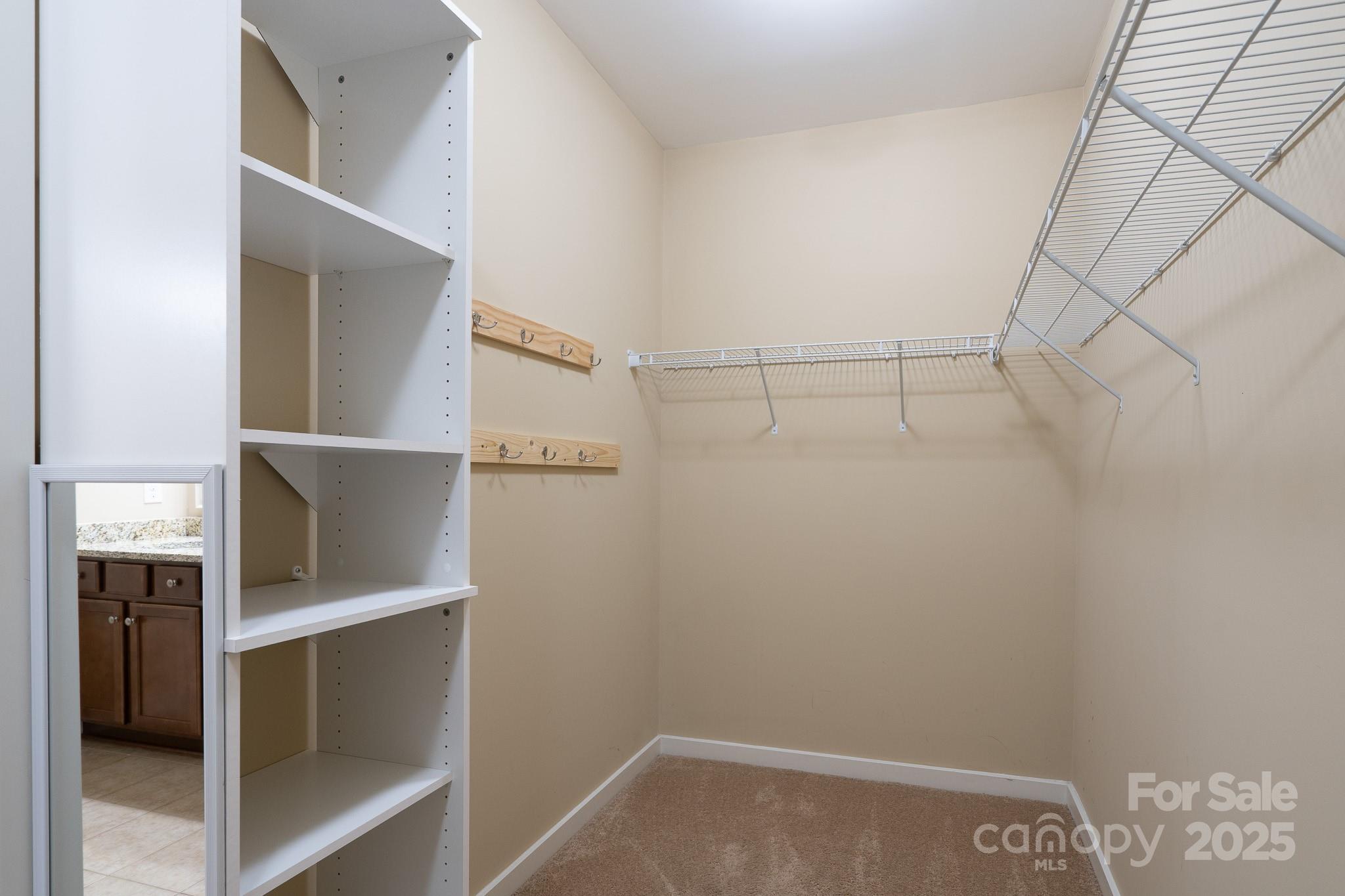 2496 Bergamot Street, Unit 61 Tega Cay, SC 29708 - Photo 24 of 43 a view of an empty walk in closet