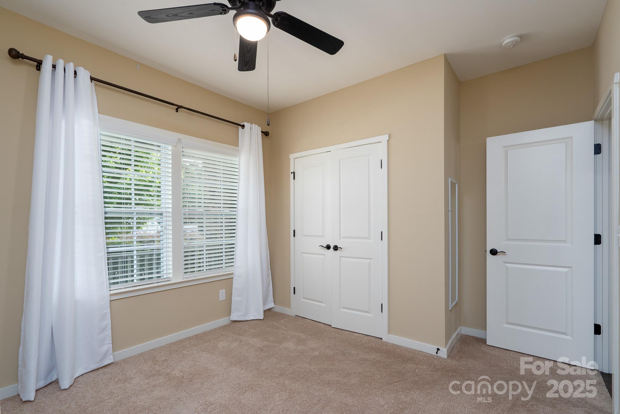 2496 Bergamot Street, Unit 61 Tega Cay, SC 29708 - Photo 25 of 43 a view of an empty room with a window
