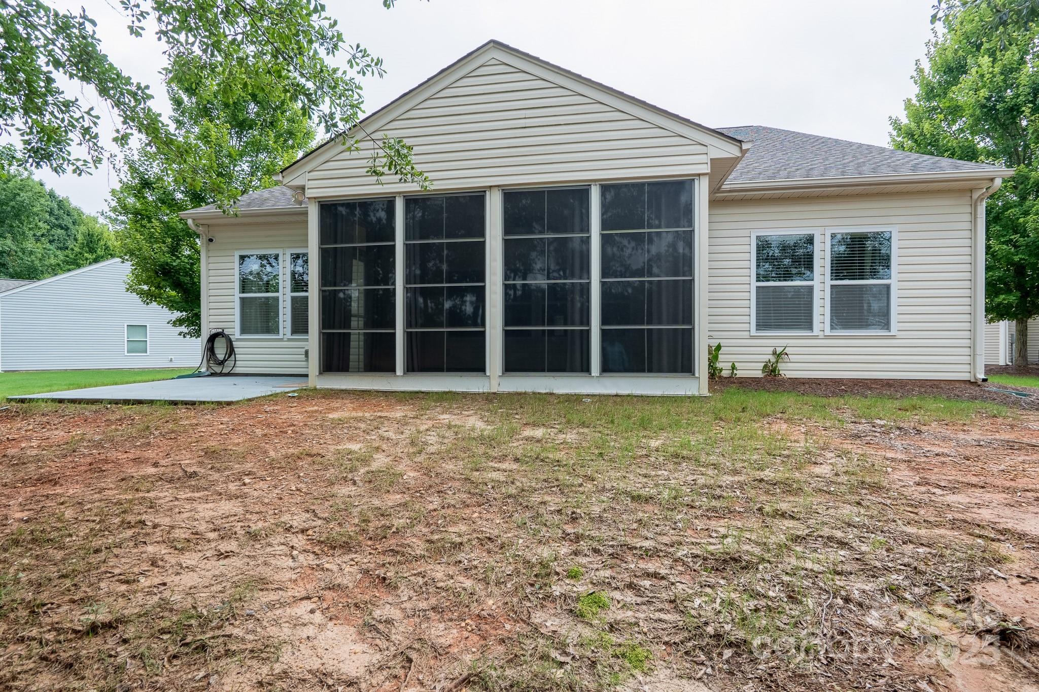 2496 Bergamot Street, Unit 61 Tega Cay, SC 29708 - Photo 36 of 43 a view of a house with a yard