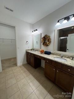 2496 Bergamot Street, Unit 61 Tega Cay, SC 29708 - Photo 43 of 43 a spacious bathroom with a double vanity sink and a mirror