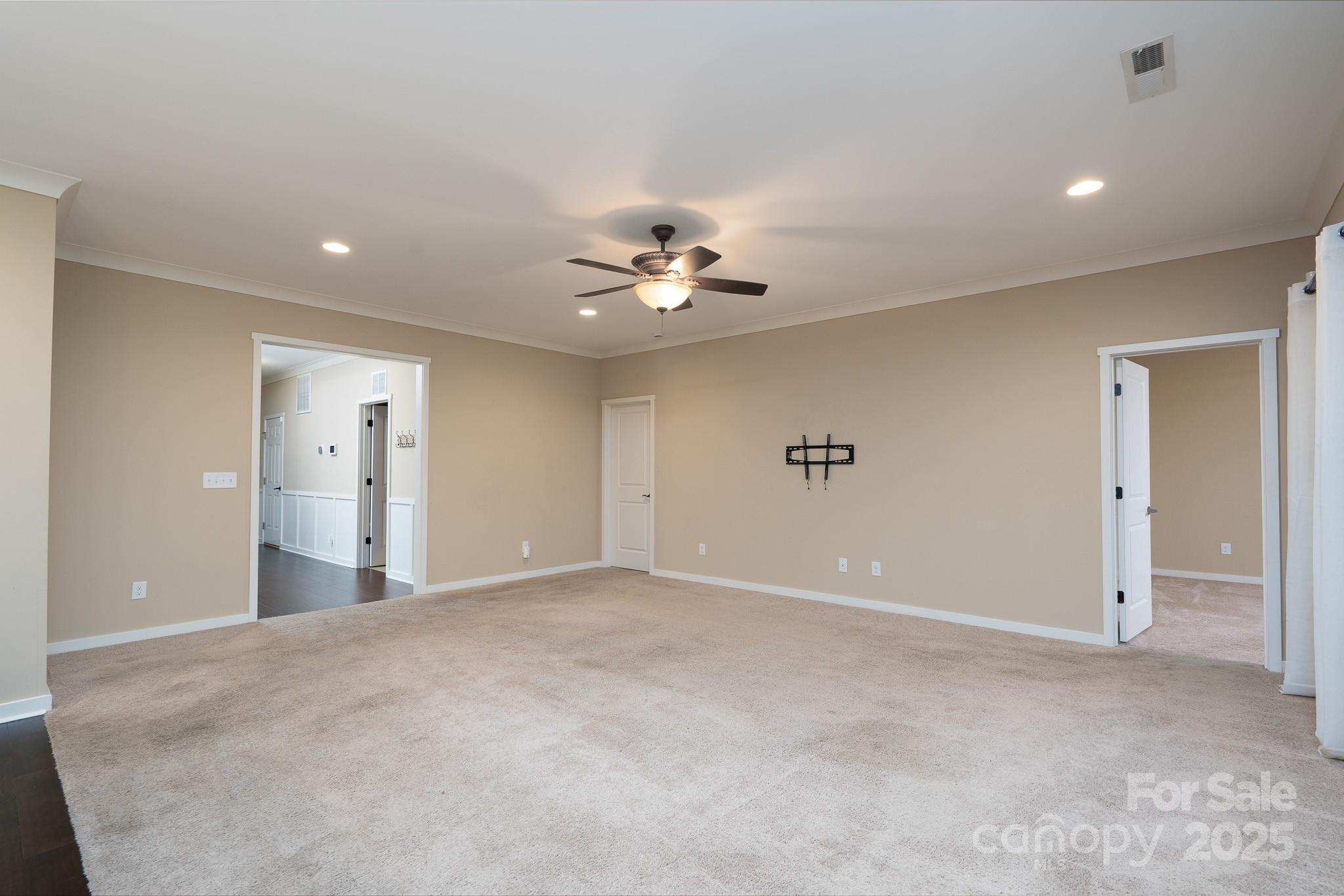 2496 Bergamot Street, Unit 61 Tega Cay, SC 29708 - Photo 7 of 43 a view of an empty room with a ceiling fan
