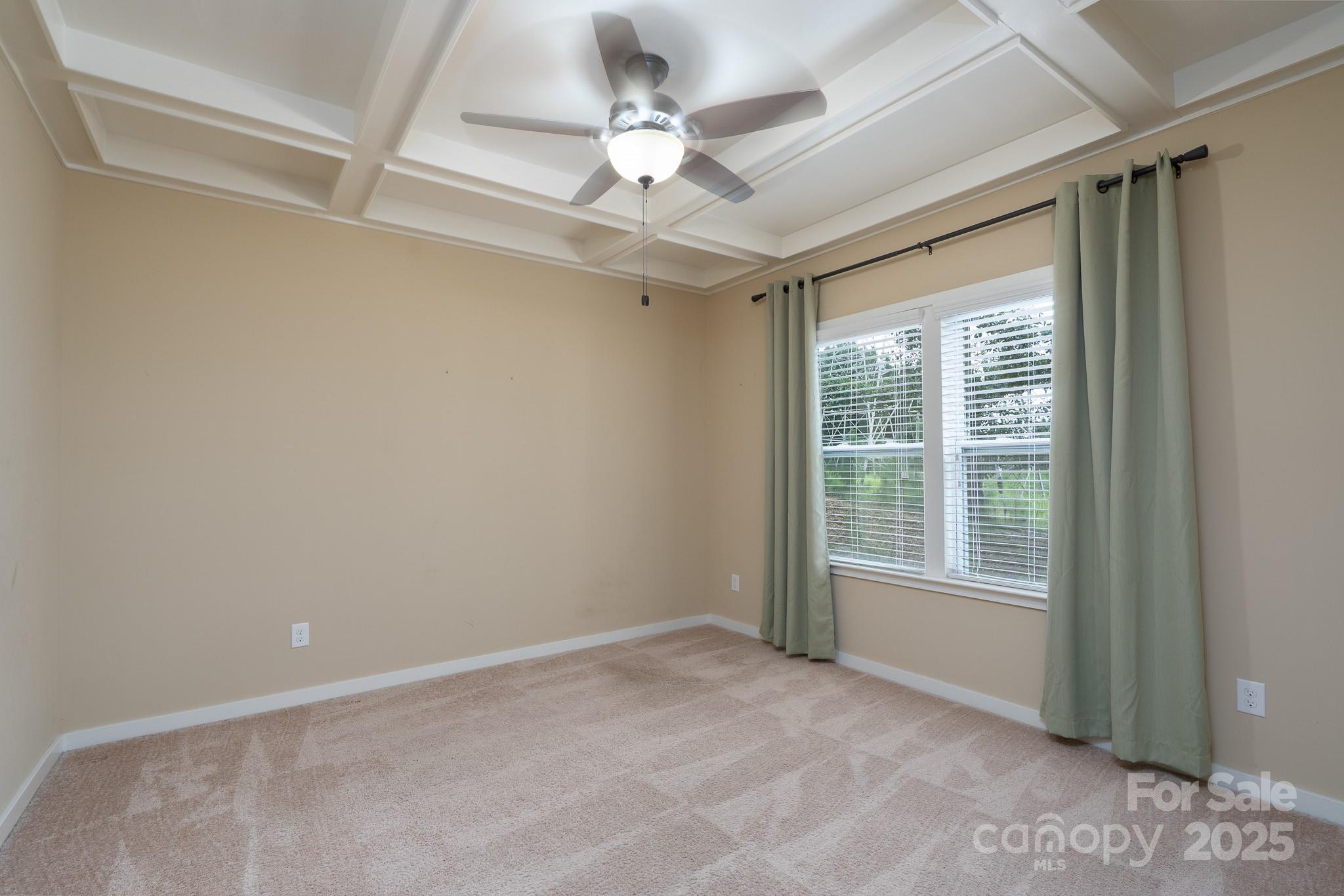 2496 Bergamot Street, Unit 61 Tega Cay, SC 29708 - Photo 8 of 43 a view of an empty room with a window