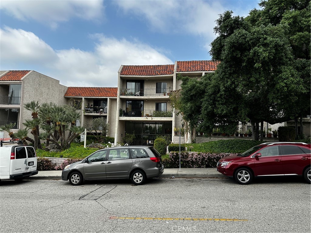 1401 Valley View Road Glendale, CA 91202 - Photo 1 of 1 a view of cars parked in front of a house