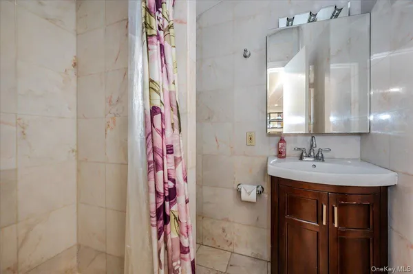 a bathroom with a sink a vanity and a mirror