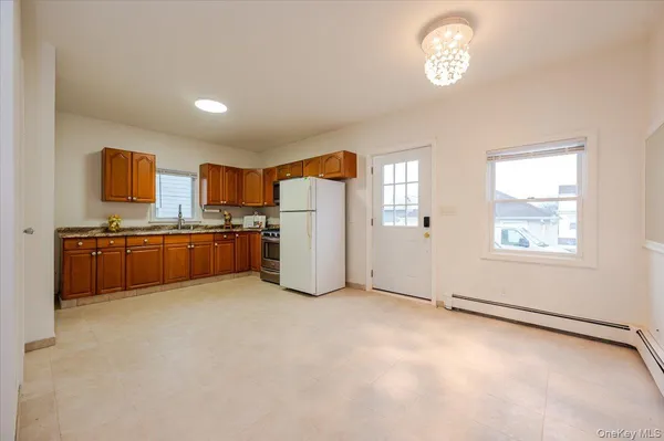 a view of kitchen with window and stainless steel appliances