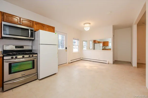 a kitchen with stainless steel appliances a stove a microwave and a refrigerator