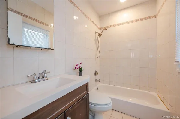 a bathroom with a sink a toilet and a bathtub