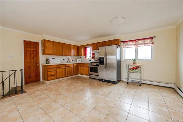 a kitchen with stainless steel appliances granite countertop a refrigerator oven a sink and dishwasher