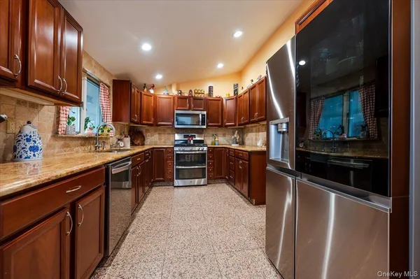 a kitchen with stainless steel appliances and sink