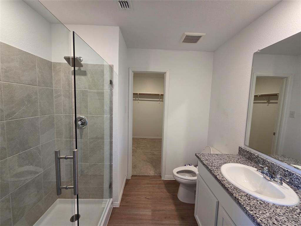 1001 Mountain Laurel Road Princeton, TX 75407 - Photo 9 of 19 Walk-in shower with clear glass enclosure and tile surround