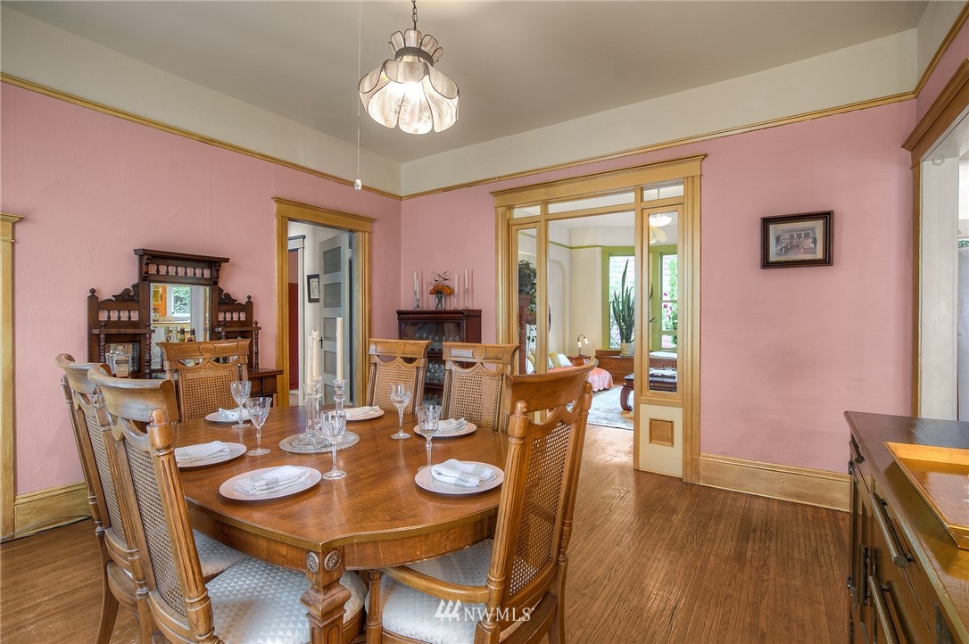 529 19th Avenue Seattle, WA 98122 - Photo 13 of 39 a view of a dining room with furniture wooden floor and chandelier