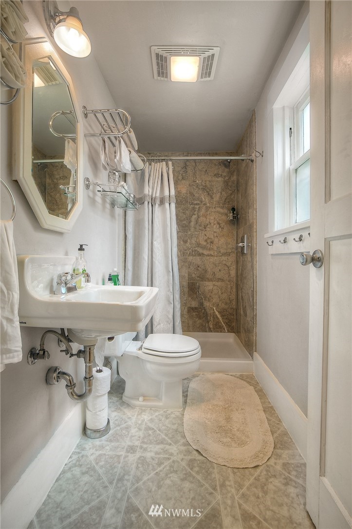529 19th Avenue Seattle, WA 98122 - Photo 18 of 39 a bathroom with a sink toilet and shower